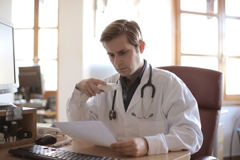 Medical expert reviewing dental digital scans